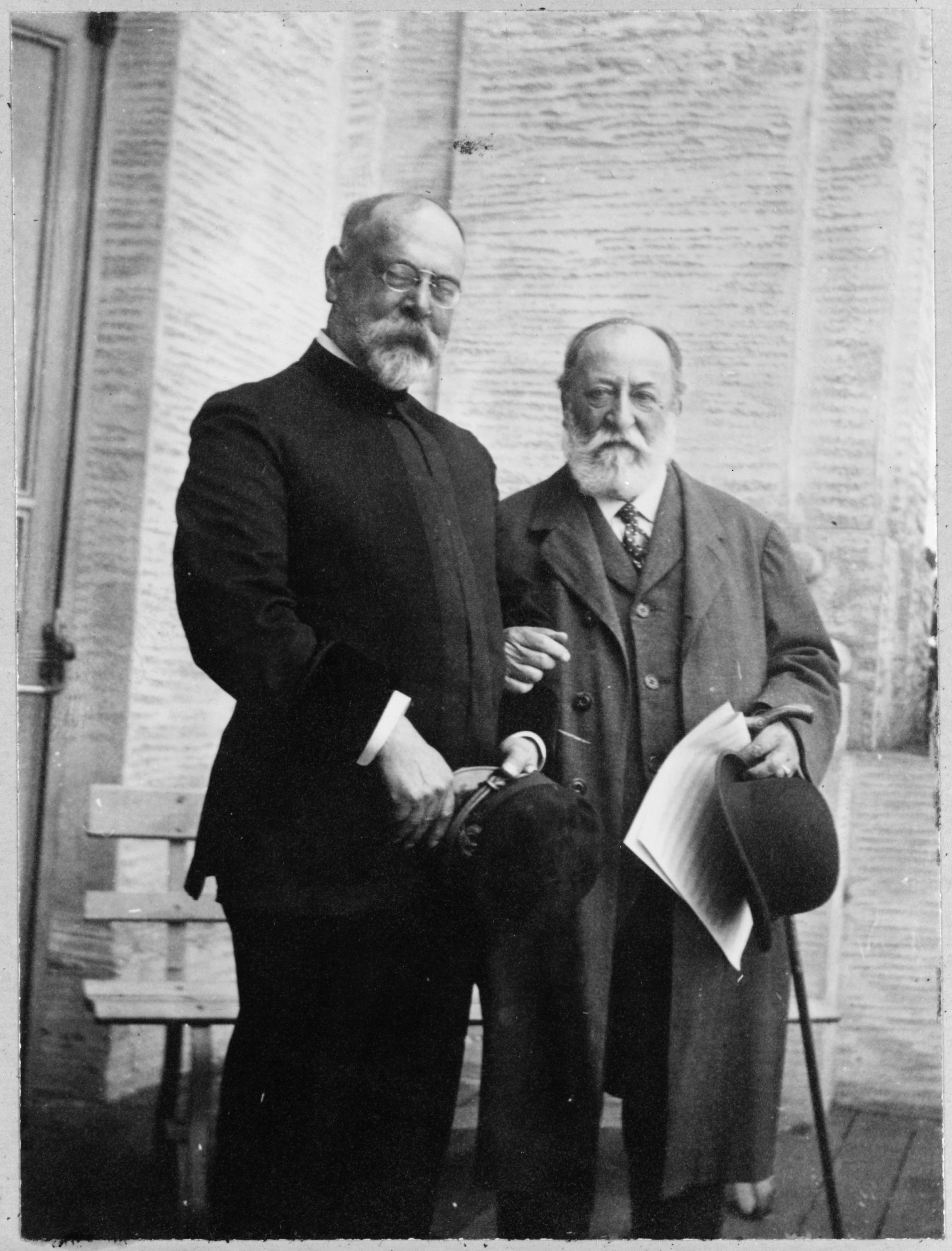 Photograph of John Philip Sousa standing with Camille Saint-Saëns